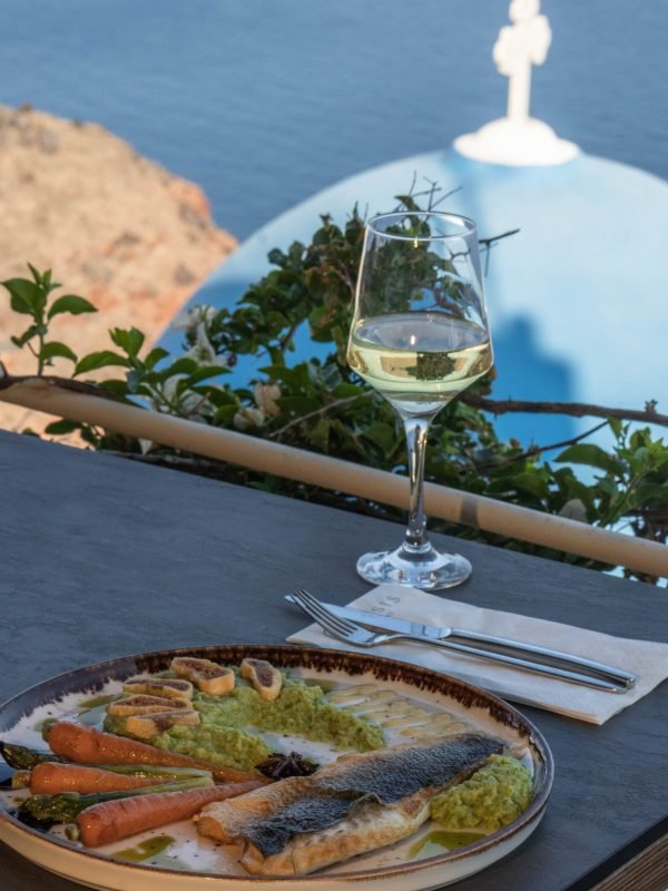 grilled sea bass with glass of wine